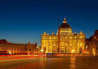 Fototapeta na wymiar St. Peter's square and cathedral in Rome at night with lights, Italy