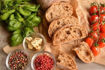 Italian background with bread, tomatoes, basil and spices