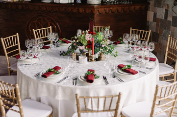 Wedding decorated white table and chairs in the castle of love