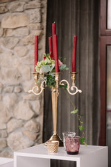 Wedding decorated candlestick with the vinous candles