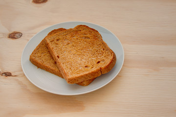 slices of toasted wheat bread on a wooden table