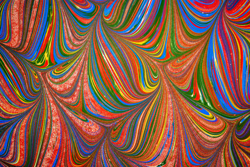 Ebru art. Traditional Turkish Ebru technique. Painting on water, followed by paper prints. Color paint ebru with waves and tile pattern.