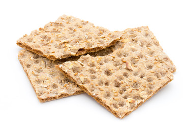Stack of wholegrain crispy bread with sunflower, chia and sesames seeds