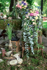 Fototapeta na wymiar Floral arrangements of herbs flowers,moss and wood.Spring,summerbouqute