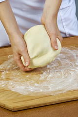 Woman rolls squeezes dough Handmade Series Food recipes