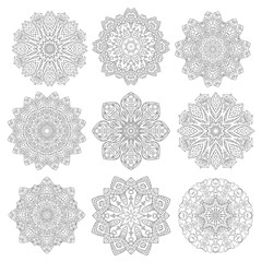 Set of 9 flower mandalas. Hand drawn design elements. Vector.