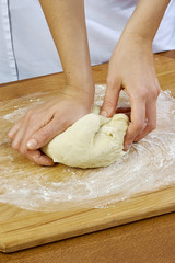 Woman rolls squeezes dough Handmade Series Food recipes