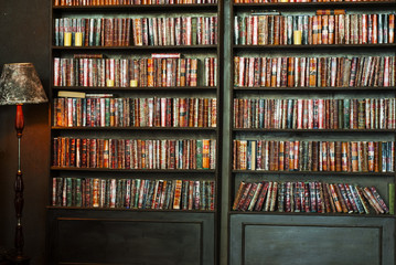 Old vintage books in bookcase. Knowledge in library