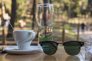 Outdoor coffee ( coffee , water & sunglasses )