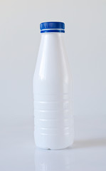 White bottle on gray background with clipping path