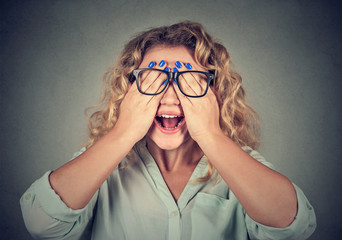 Closeup portrait woman in glasses covering face eyes with both hands