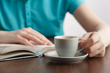 closeup of girls handswhile reading book