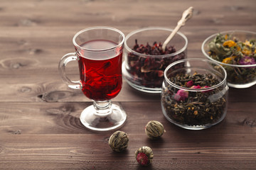 Mallow tea in glass with dried mallow blossoms