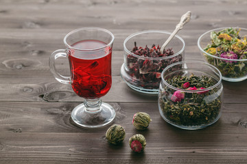 Mallow tea in glass with dried mallow blossoms