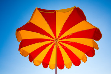 Low angle view of beach umbrellas against sky