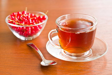 Glass tea cup on wooden table