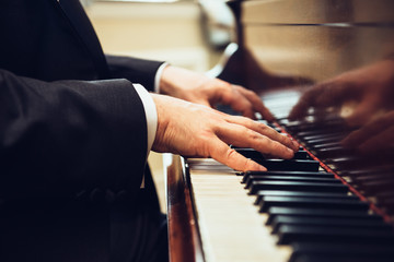 Obraz na płótnie Canvas Playing classic piano. Professional musician pianist hands on piano keys..
