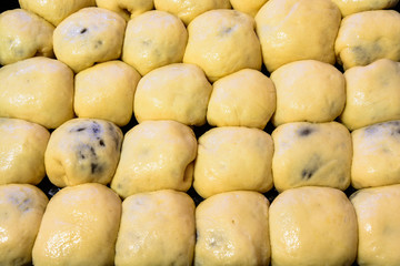 Czech baked buns with jam and sugar. Baking cakes. Traditional Czech recipe for buns. Festive delicacies. Buns on a baking pan.