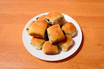 Czech baked buns with jam and sugar. Baking cakes. Traditional Czech recipe for buns. Festive delicacies. Buns on a plate.