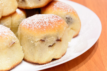 Czech baked buns with jam and sugar. Baking cakes. Traditional Czech recipe for buns. Festive delicacies. Buns on a plate.