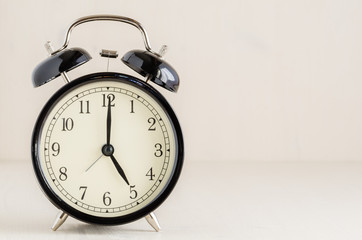 Vintsge Alarm Clock on a Wooden Background