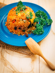 Vintage style closeup Thai cuisine style vegetarian fried rice on stretcher plate and wooden background wallpaper