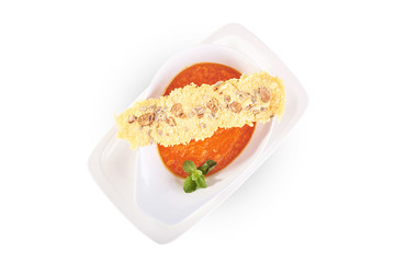 Tomato cream soup in white plate