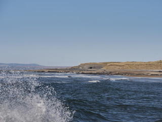 Waves running toward beach.