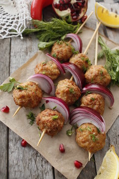 Kofta skewers, meatballs and red onion delicious oriental cuisine, top view