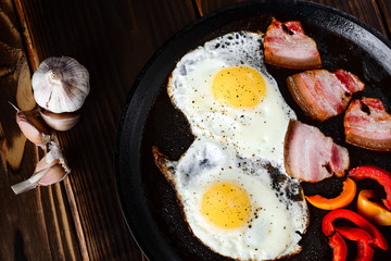 Fried eggs in a frying pan in a rural