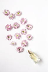 Bottle of fragance coming out flowers