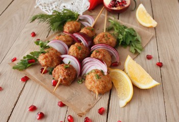 Kofta skewers, meatballs and red onion delicious oriental cuisine, top view