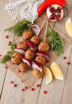 Kofta skewers, meatballs and red onion delicious oriental cuisine, top view