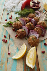 Kofta skewers, meatballs and red onion delicious oriental cuisine, top view