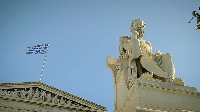 Statue of the Greek Philosopher Socrates background of Greek Flag