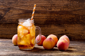 jar of peach iced tea with fresh fruits