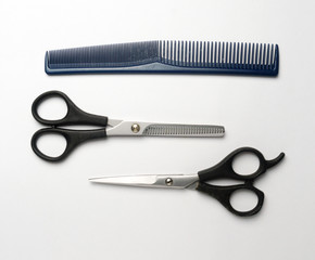scissors and comb hair