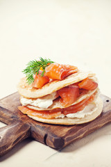 Pancakes with salmon and cream cheese