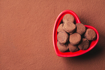 Chocolate truffles in a heart shaped bowl