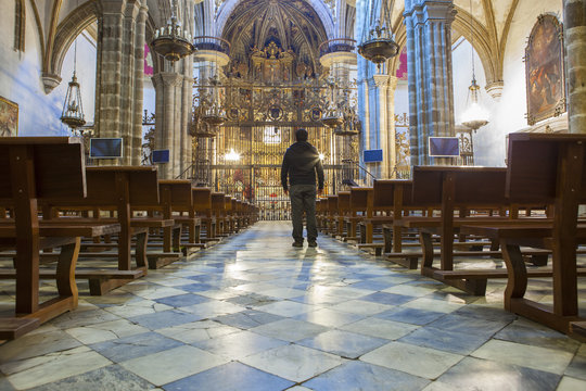Tourist at Guadalupe Monastery Basilica, Spain