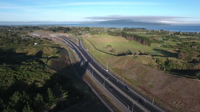 Aerial view of the Kapiti expressway with Kapiti Island in the background.