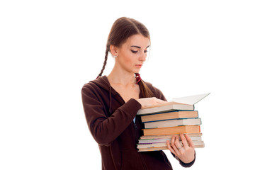 cute teen girl with pigtails holds many books