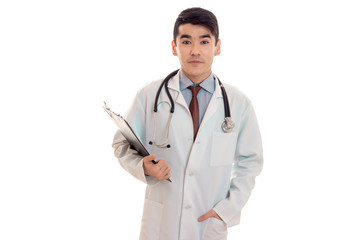 a young doctor in a white lab coat with a stethoscope holding a Tablet for securities