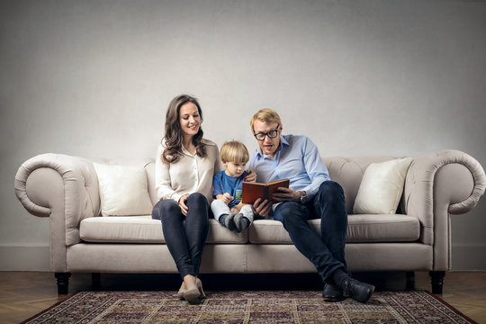 Parents reading to their child