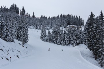 Fototapeta premium Two people skiing in the mountains of Austria.