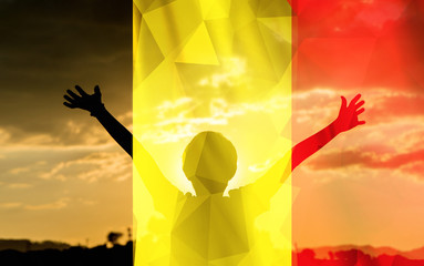 Young man raising his hands on a sunset background with a flag background - 139373973