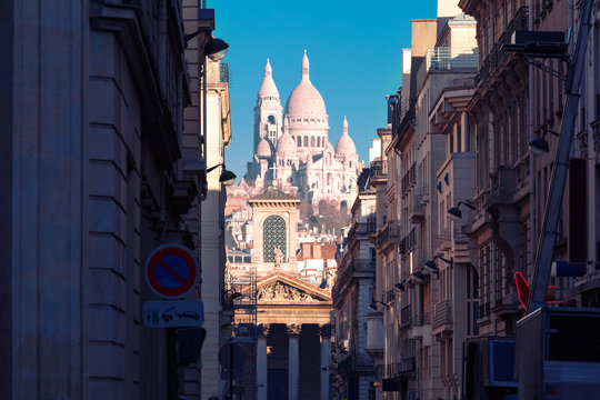 Sacre-Coeur Basilica or Basilica of the Sacred Heart of Jesus and Notre-Dame de Lorette church, seen from Rue Laffitte in the winter morning, Paris, France