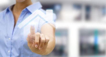 Businesswoman touching 3D rendering icon house with her finger