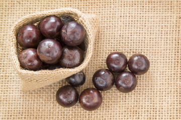 Berry Jaboticaba on wooden table (Plinia cauliflora)