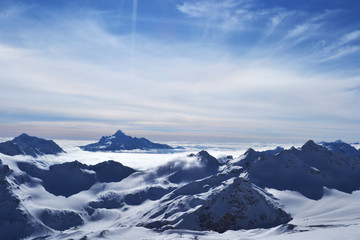 Beautiful view on the winter mountains. amazing landscape with ridge, blue sky, floating clouds.